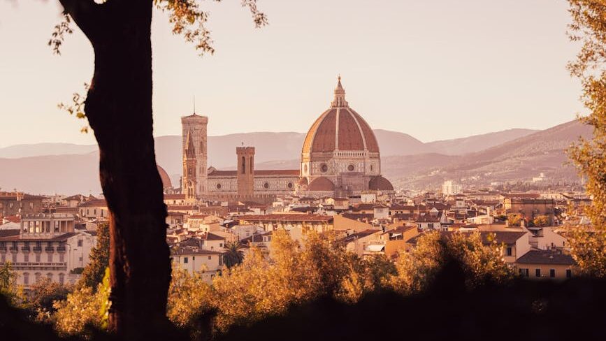 trees and town with church behind